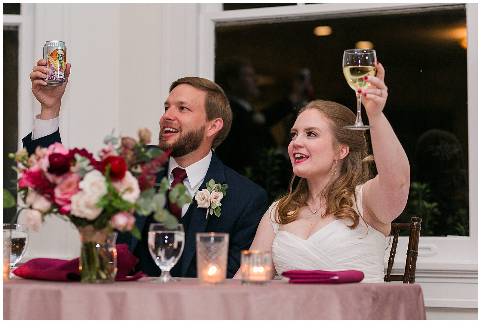 Bride and groom raise glasses for toast