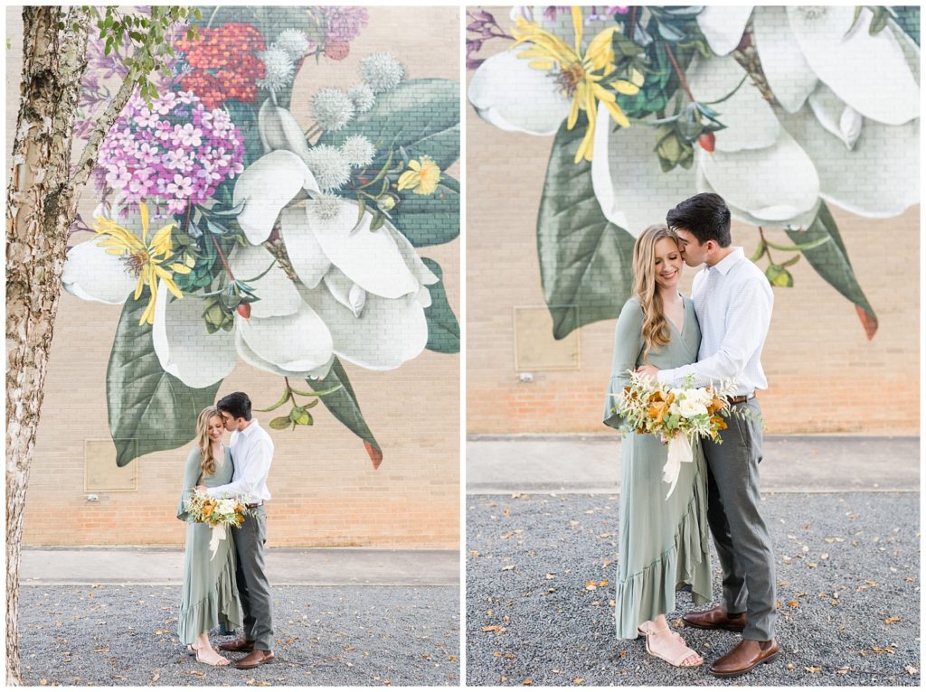 couple poses in front of floral street mural outside NC museum of art Raleigh
