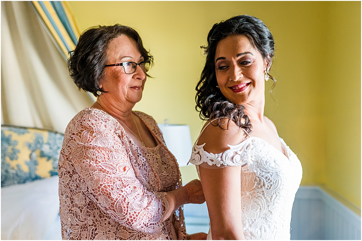 Melissa's mother helping her get ready at Jolo Winery Wedding