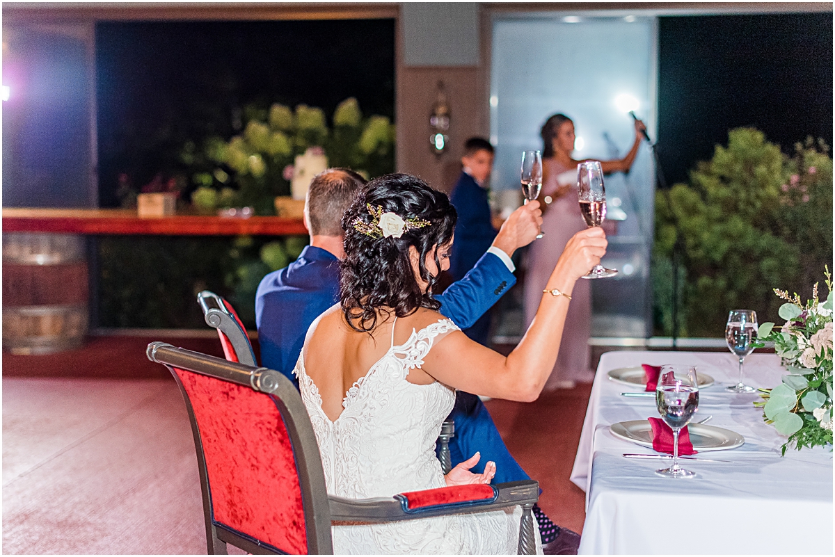 Side shot of Koy and Melissa toasting