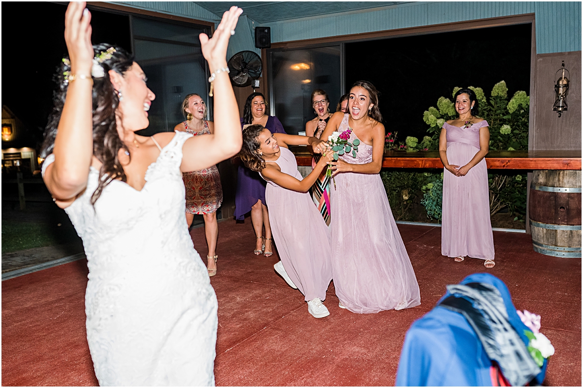 Throwing the bouquet at Jolo Winery Wedding
