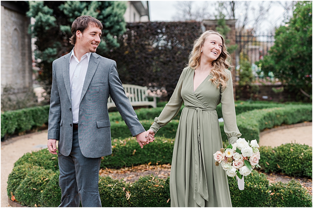 Couple holding hands and looking to the left during Engagement Photography in Raleigh Durham NC.jpg