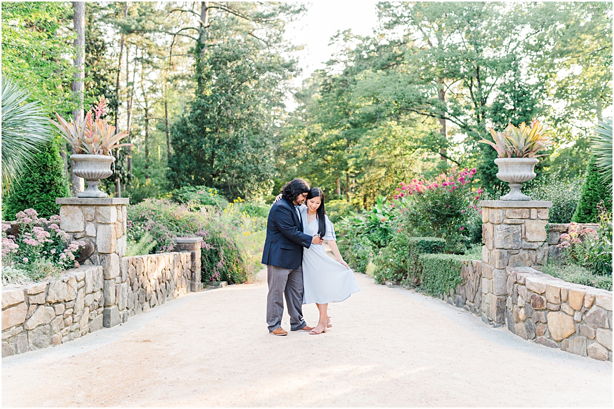 Couple posing in a walkway in Duke Gardens during Engagement Photography Raleigh Durham NC