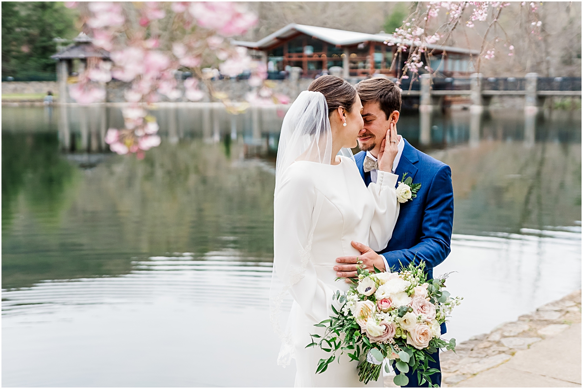 Eleanor and Justin in front of Lake Susan during Cherry Blossom Wedding