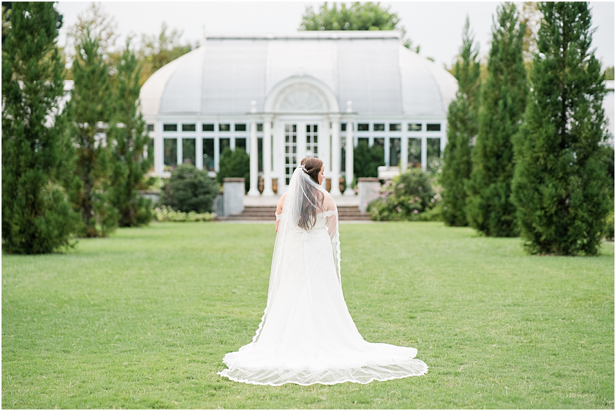 Bride in front of greenhouse at Reynolda Gardens during Bridal Portraits session in North Carolina
