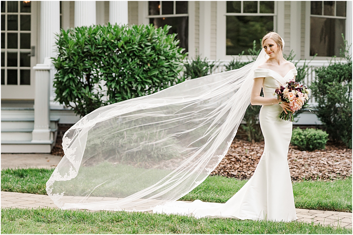 Bride with veil flowing in the breeze during Bridal Portraits session in North Carolina 