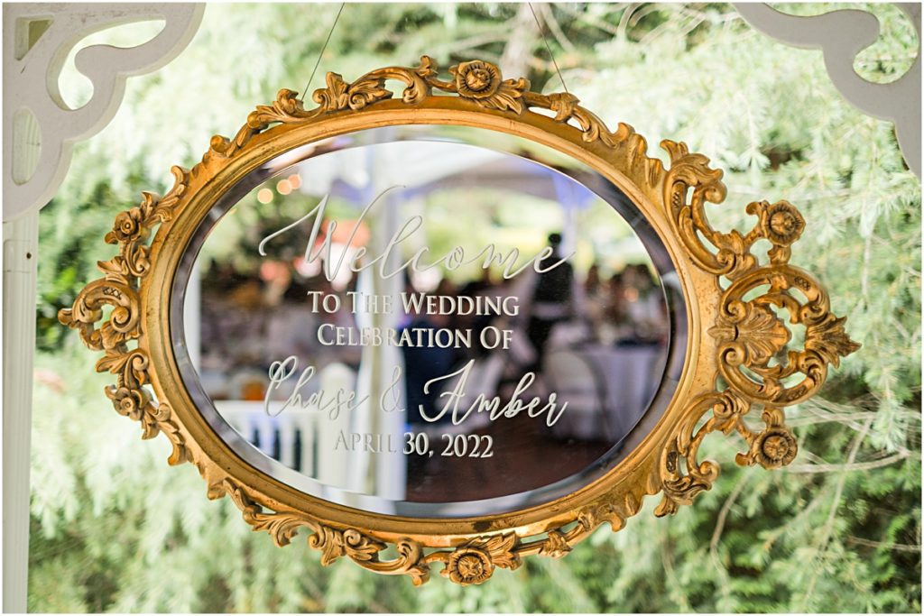 A mirror with Welcome to the Wedding Celebration of Chase and Amber 