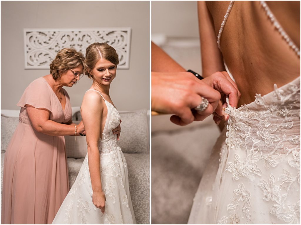 Brynn's mother helping her get ready, buttoning up her dress taken by a wedding photographer