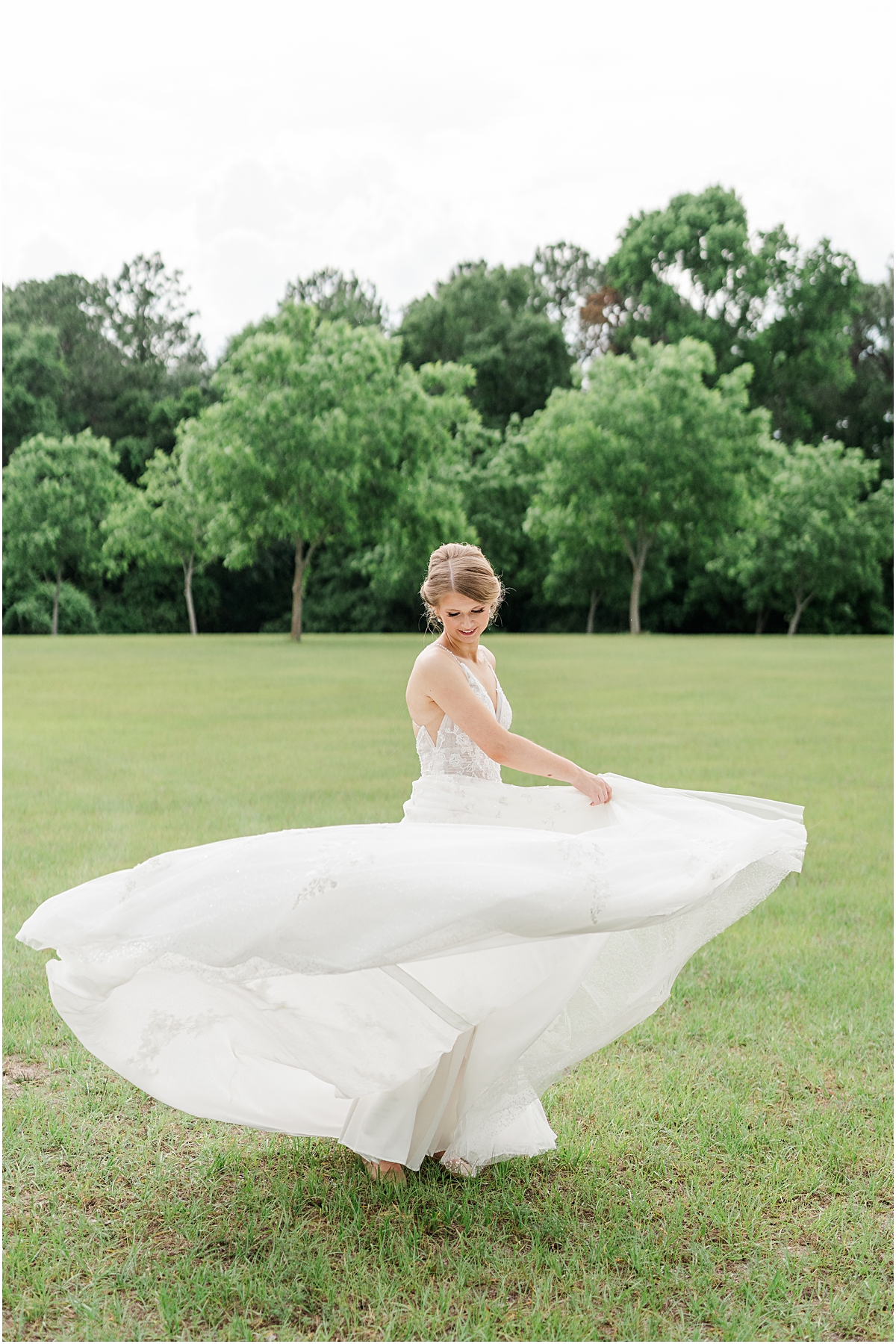 Brynn flaring her dress taken by a wedding photographer