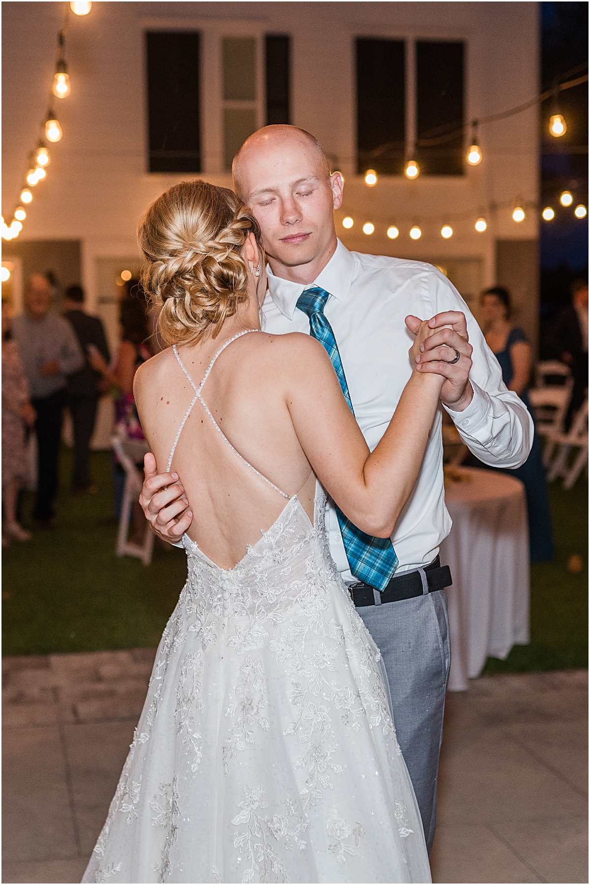 Luke and Brynn dancing closely taken by a wedding photographer