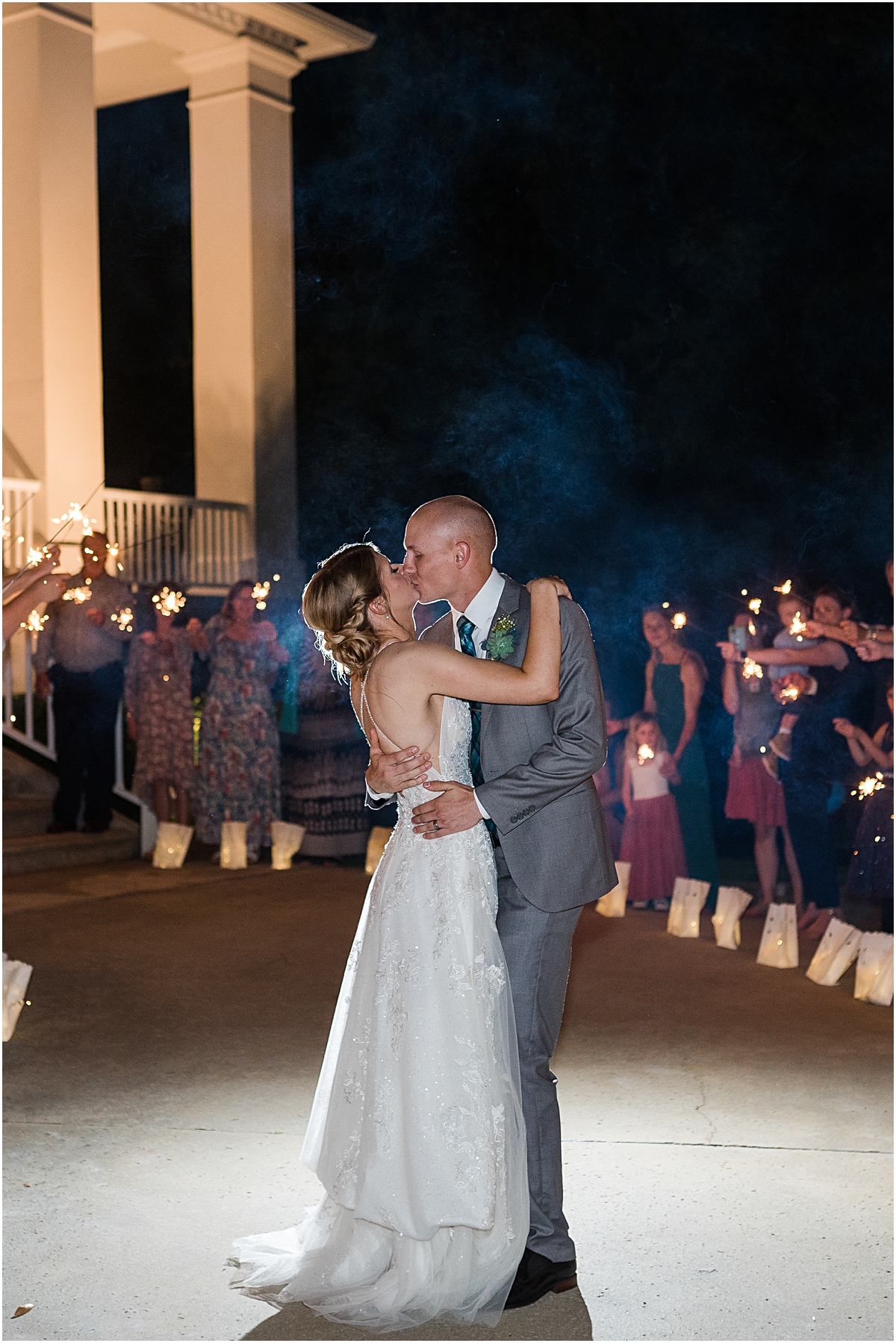 Luke and Brynn kissing during their sparkler exit