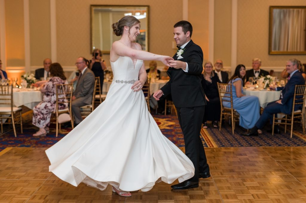 Matt spinning his bride, Haley during their first dance at Washington Duke Inn and Golf Club.