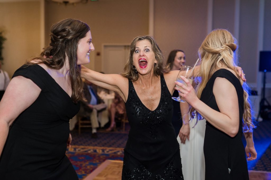 A very excited wedding guest at Haley and Matt's reception in Raleigh, NC, during their Wedding in Raleigh NC