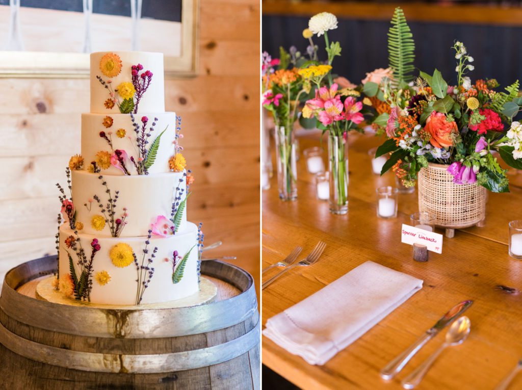 Collage of a colorful, floral wedding cake on a wine barrel and the centerpieces set on a wood table.