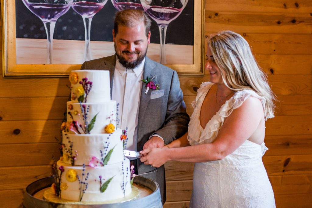 The bride and groom during their cake cutting at Medaloni Cellars.