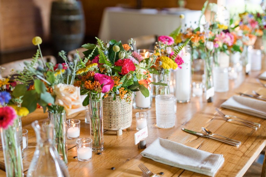 Colorful floral centerpieces on a gorgeous table designed by Events by Summer Joy, a Triad wedding planner.