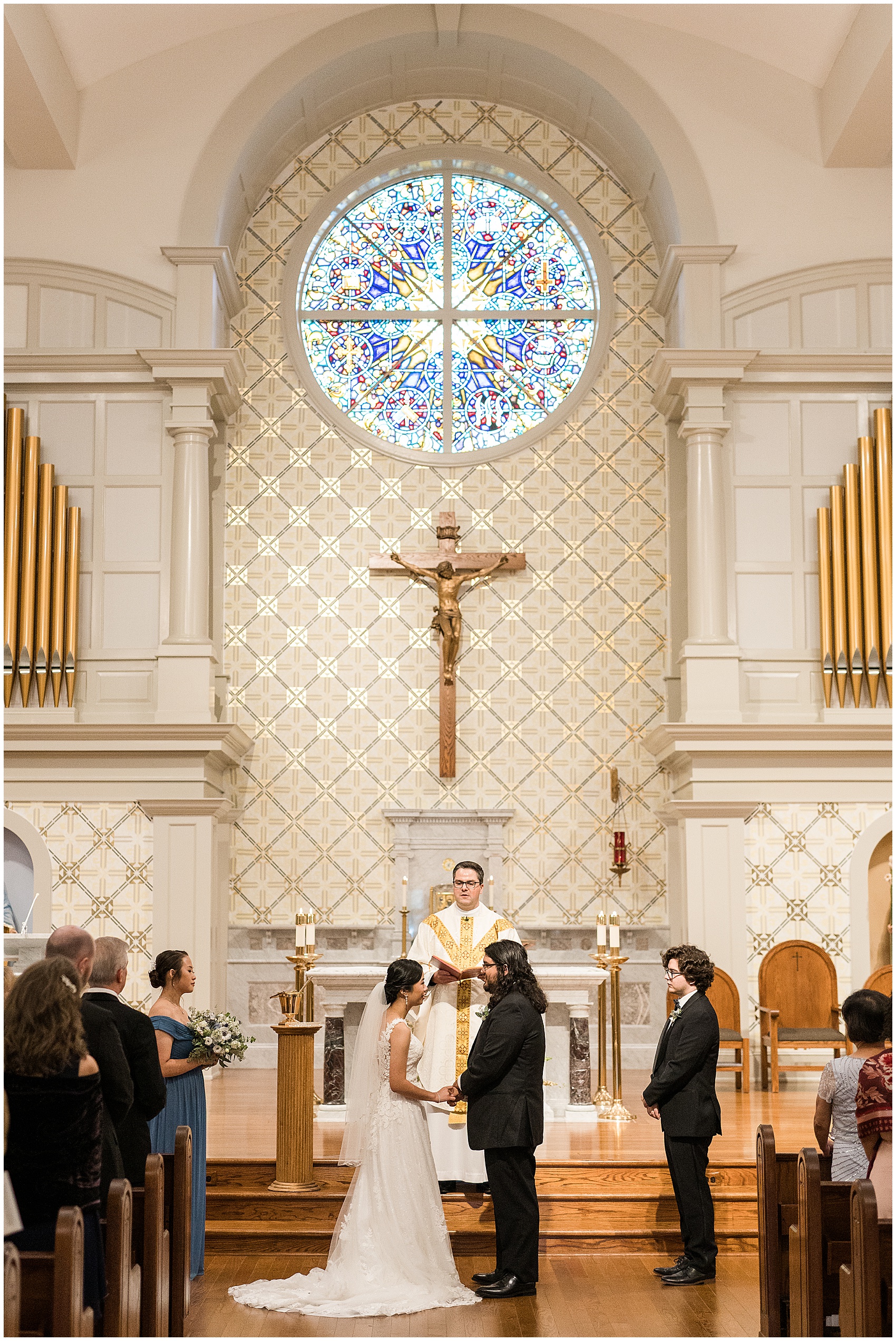 bride and groom standing at the altar of a church