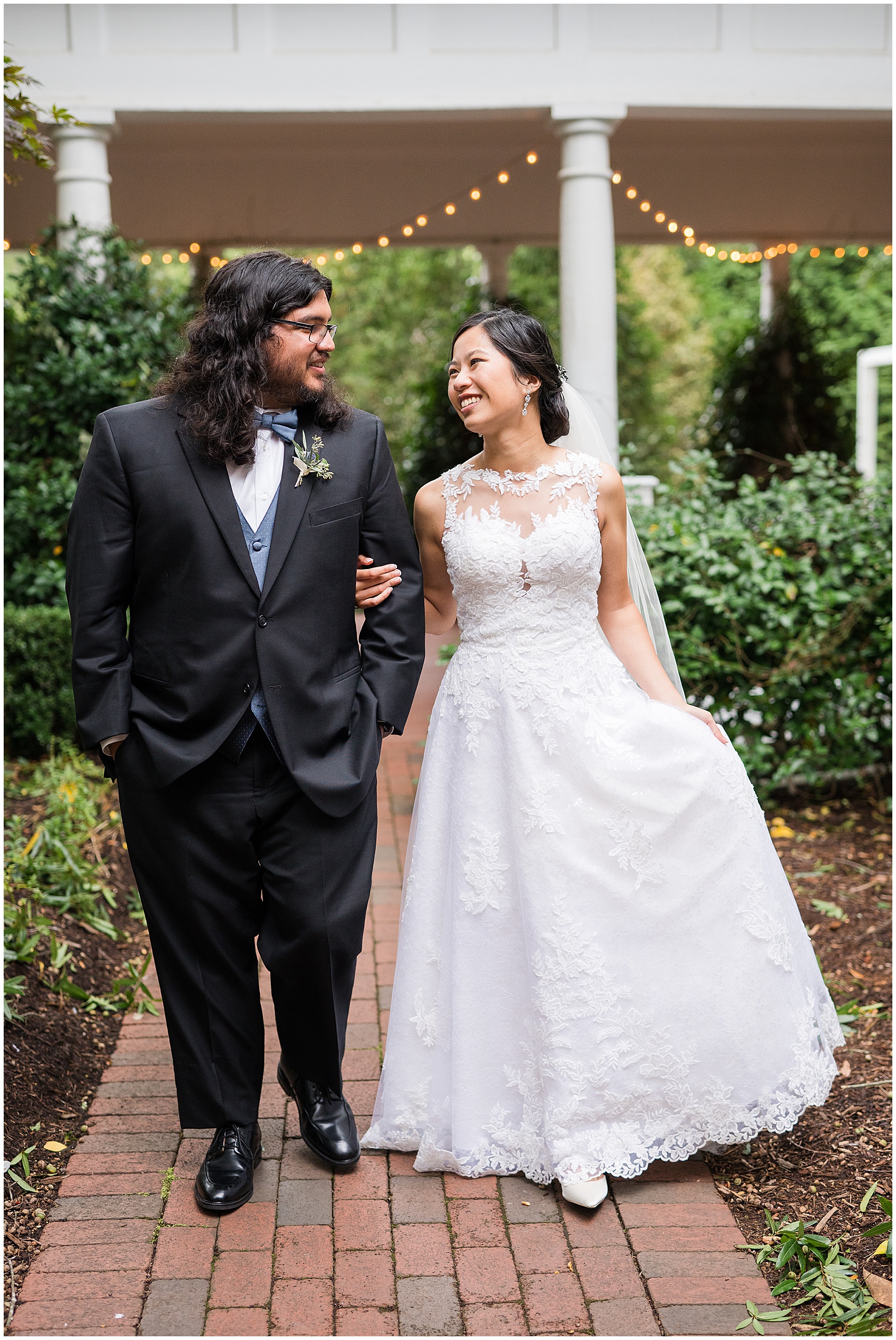 bride and groom walking and smiling at their A Stunning and Historic Leslie Alford Mims House Wedding