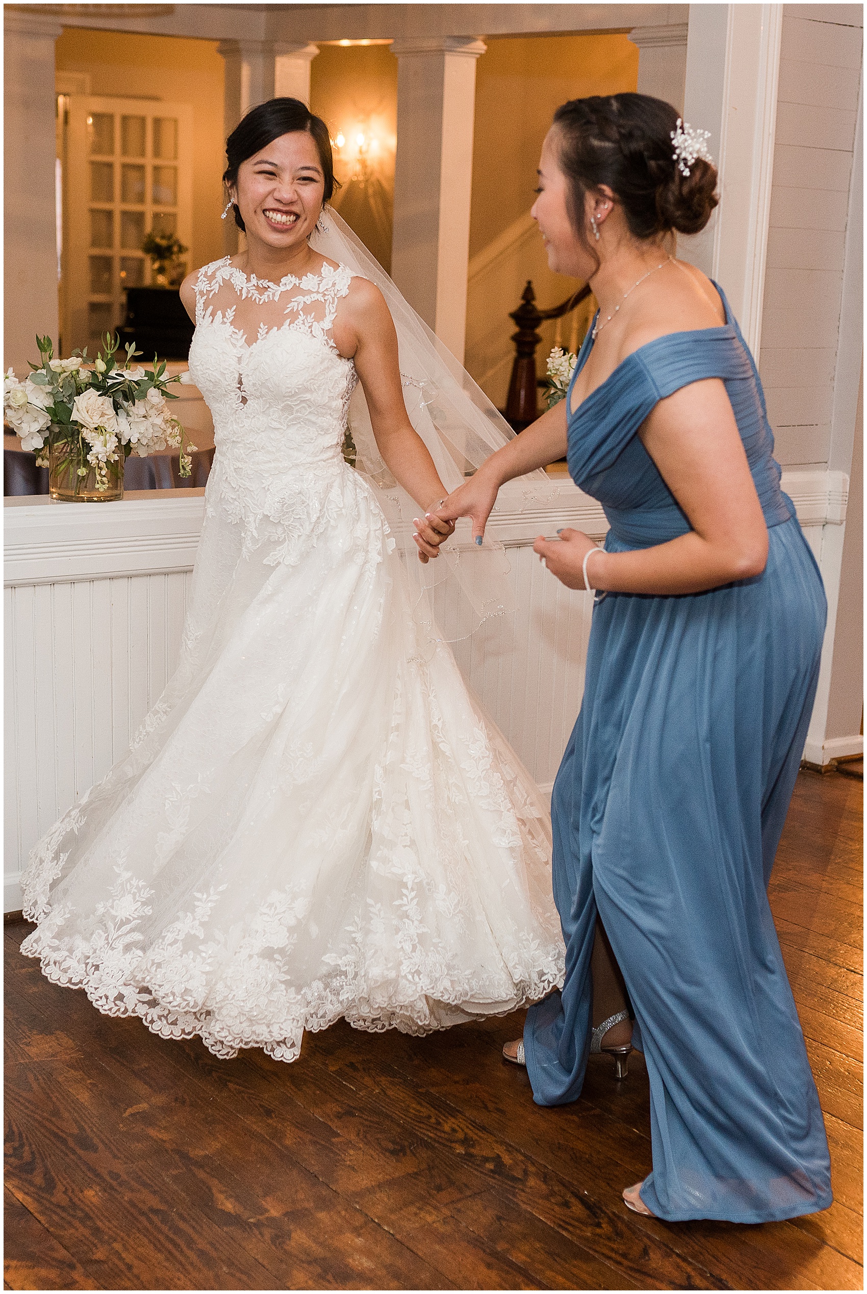 bride dancing with her bridesmaid at her reception