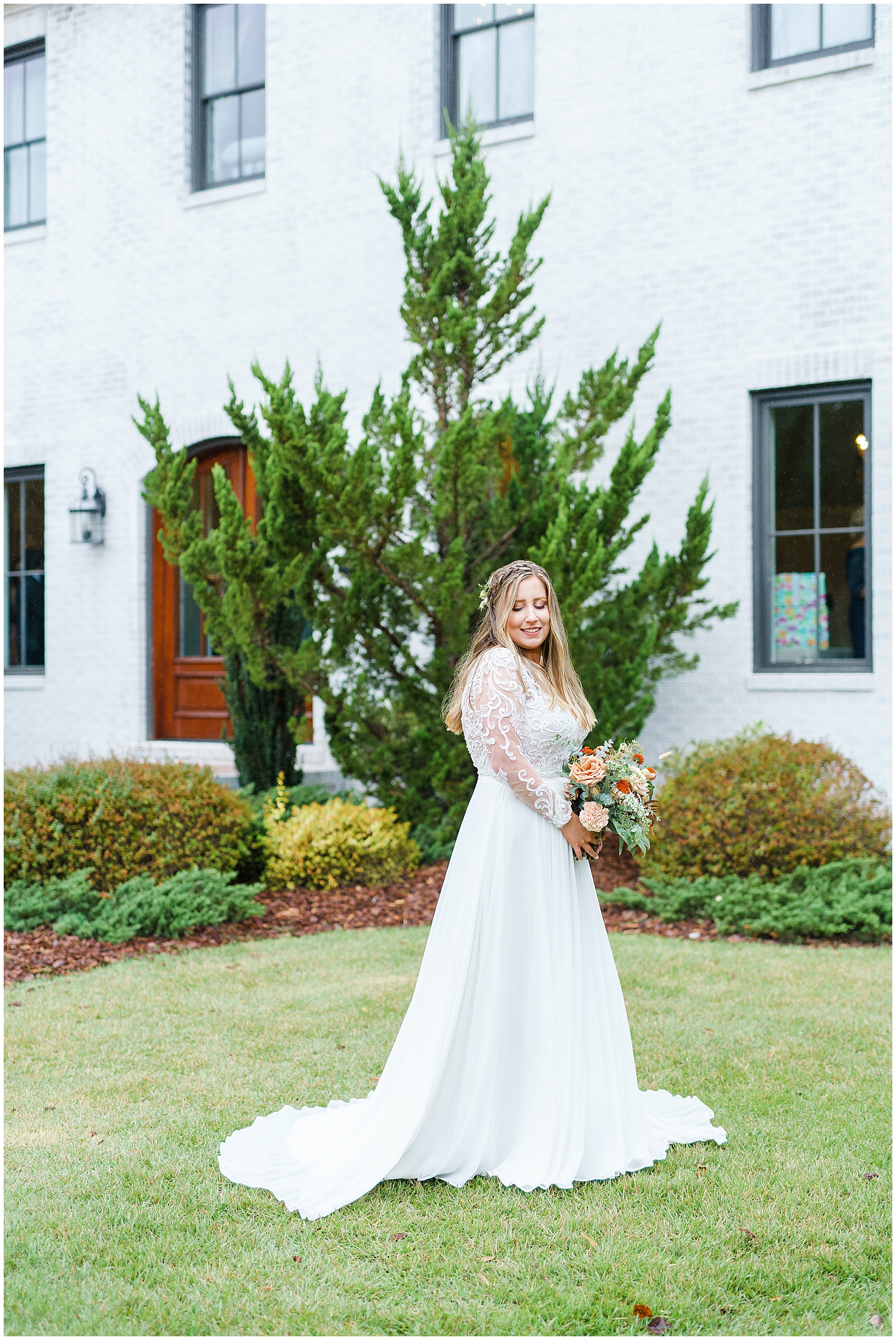 bride holding her bouquet in front of The Bradford Wedding Venue